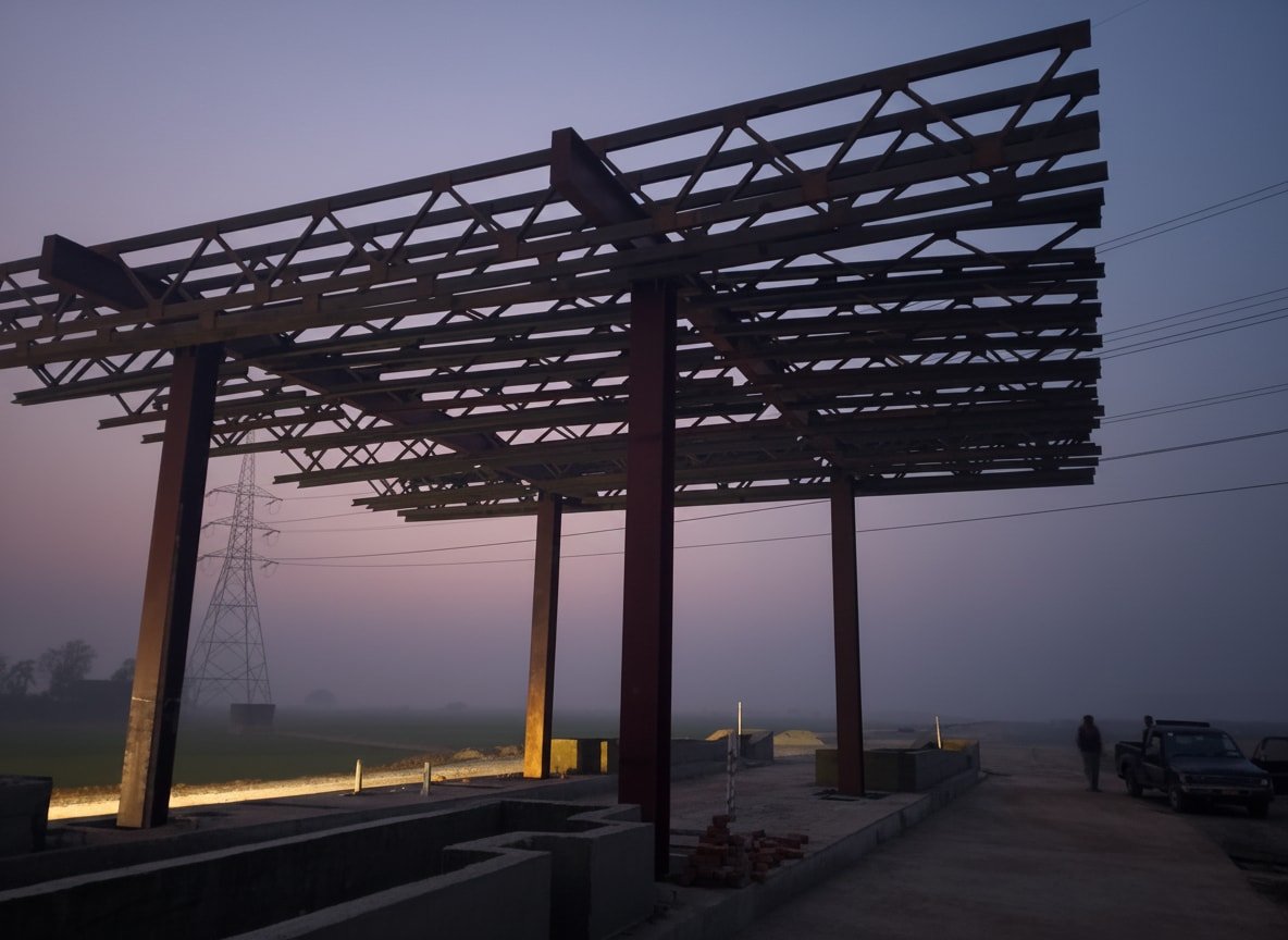 Steel toll plaza canopy at dusk