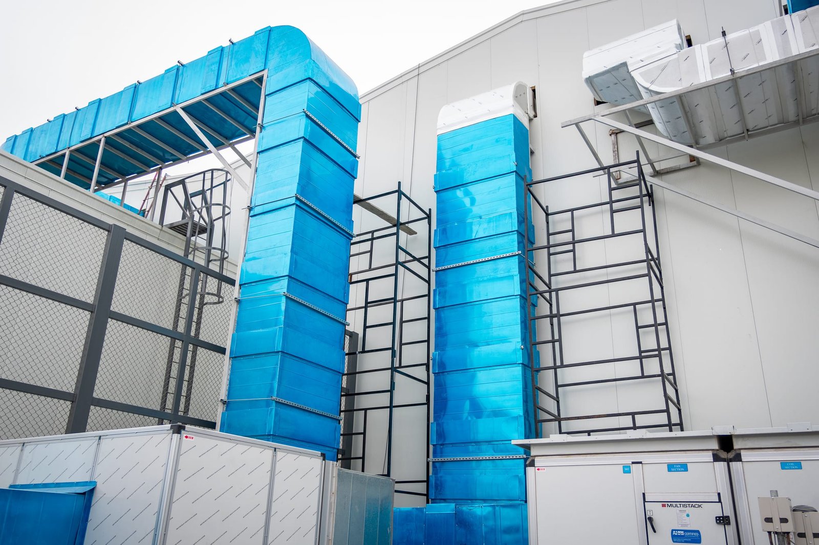 Insulated HVAC air-handling risers on a SEED-built production facility